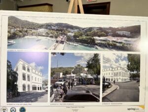 An easel displays four images of what the new deCastro Clinic might look like when it’s built in Cruz Bay. (Source photo by Amy H. Roberts)