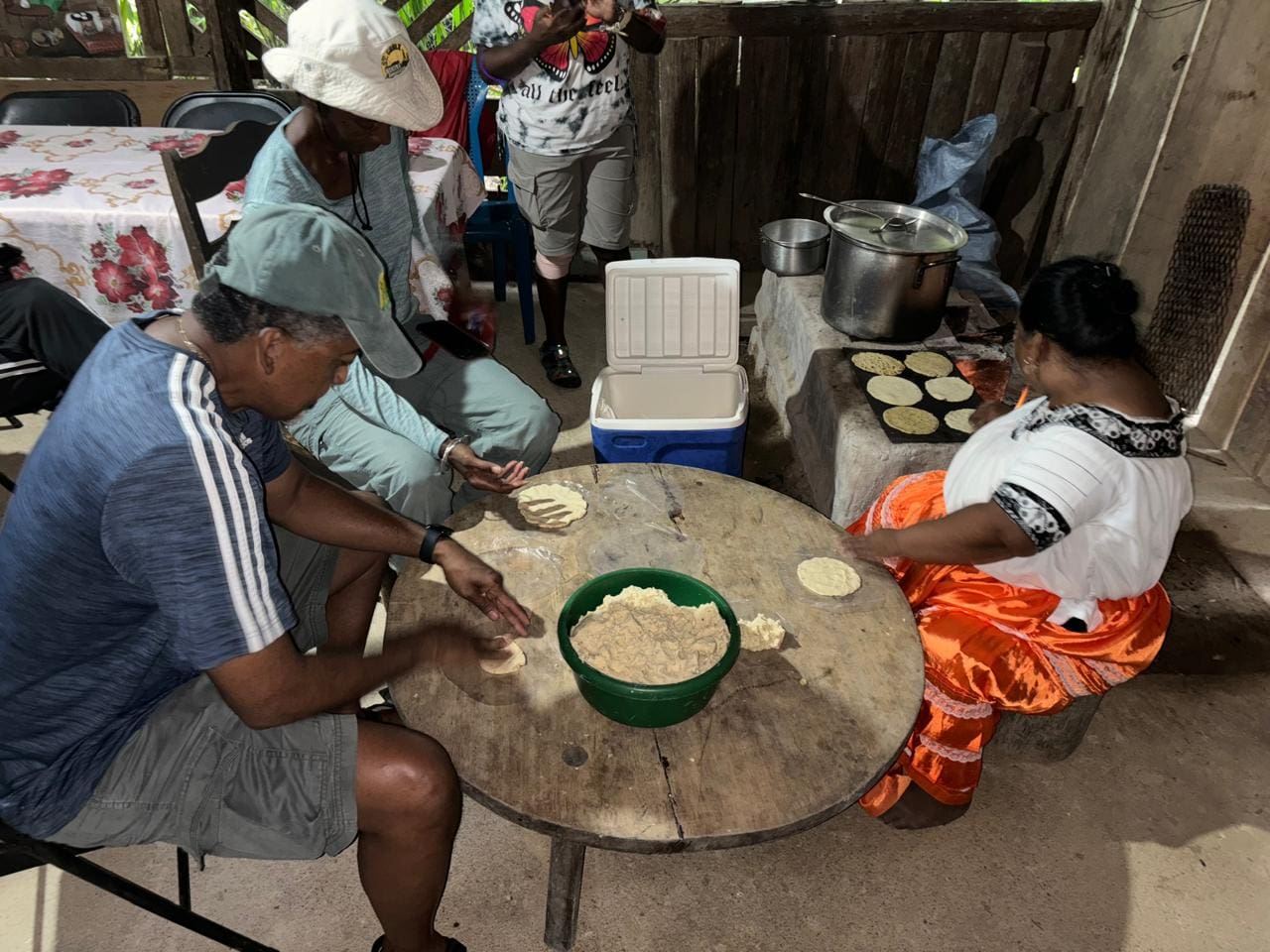 Jerry Prince, Cathy Prince tour guide Ben's wife prepare the tortillas to be fried. (Photo by Olasee Davis)