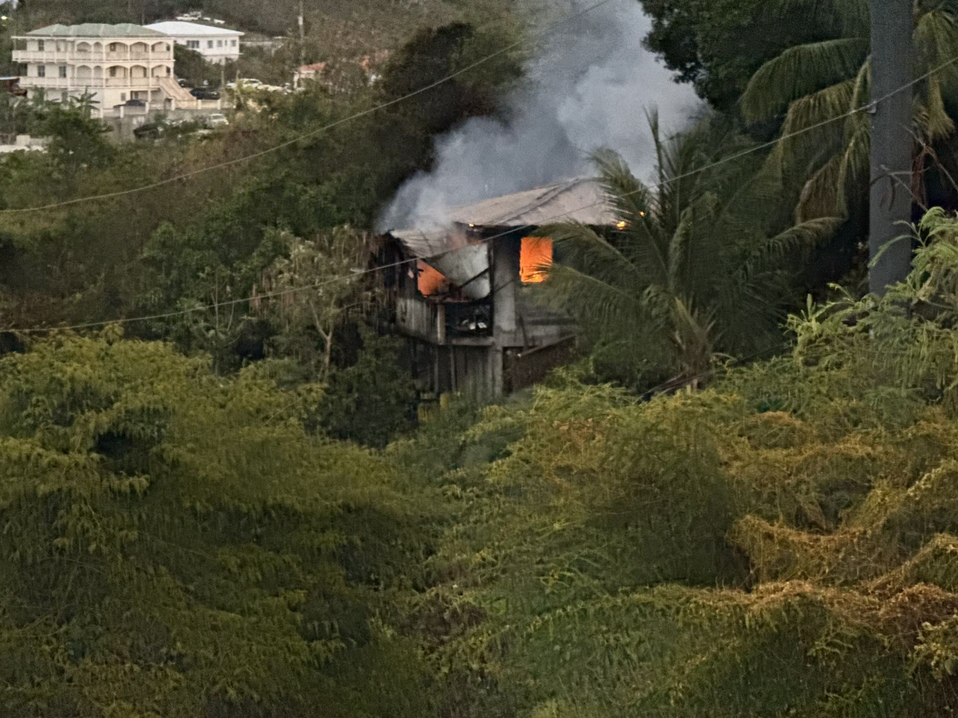 A home in the Mariendahl area of St. Thomas erupted in flames Thursday evening. (VIFEMS photo)