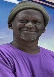 Alfred John Dies at 64