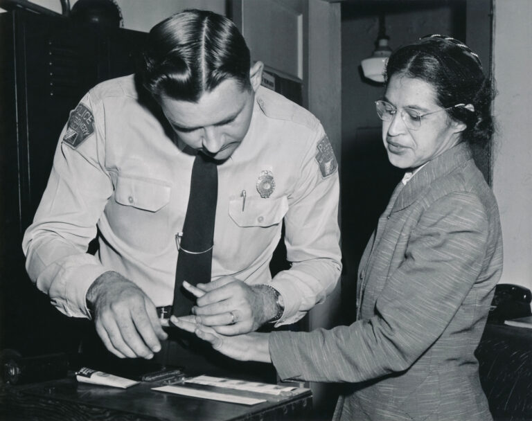 Rosa Parks being fingerprinted on February 22, 1956, by Lieutenant D.H. Lackey as one of the people indicted as leaders of the Montgomery bus boycott. She was one of 73 people rounded up by deputies that day after a grand jury charged 113 African Americans for organizing the boycott. This was a few months after her arrest on December 1, 1955, for refusing to give up her seat to a white passenger on a segregated municipal bus in Montgomery, Alabama. (AP image courtesy Wikipedia)