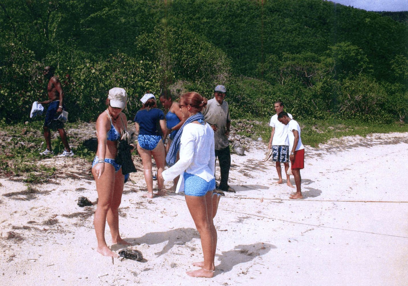Former UVI Professor Roy Watlington with his green hat on his head and his students exploring the Perseverance Bay coastal environment. Photo by Toni Thomas