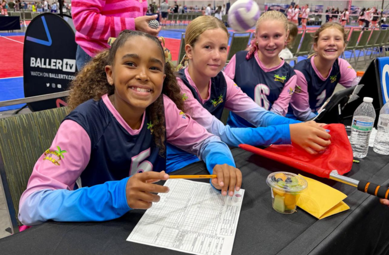 Island Mixx 12U (left to right) Arianna Gumbs, Seava Brin, Annalise Komives, and Jayla Bermudez work the table for one of the matches at the 2026 AAU National Volleyball Championships. (Photo by Christine Thompson)